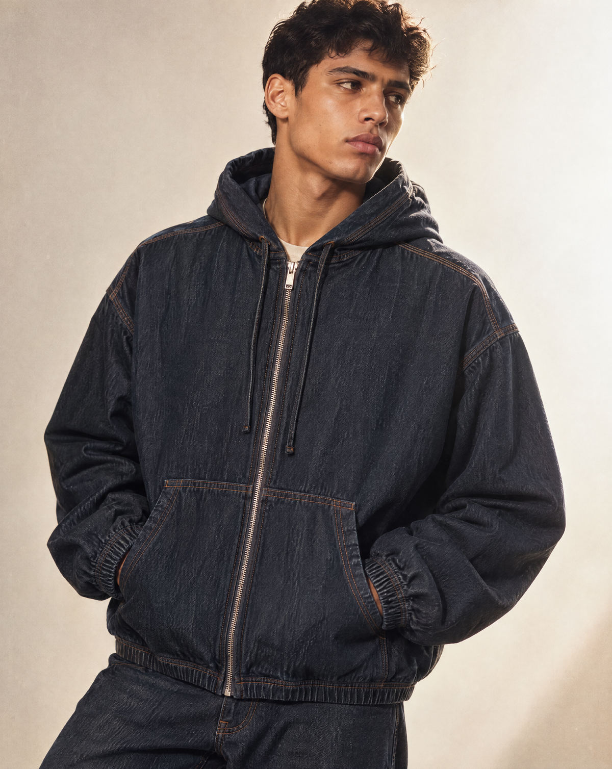 Create a hyper-masculine, seasonal editorial candid photoshoot @M | boxy vintage wash hooded denim jacket