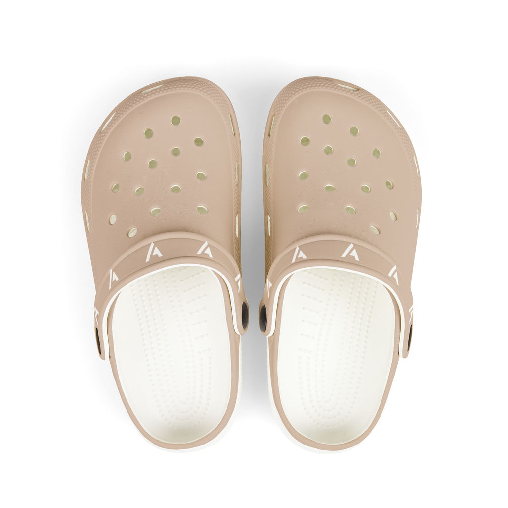 A pair of light beige clogs with white footbeds, shown from a top-down view on a white background.